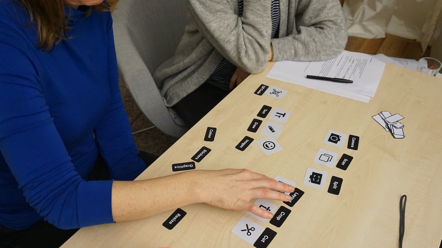 a participant during a usability test conducting a card sorting exercise