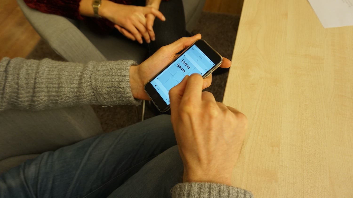 a participant during a usability test with the app prototype